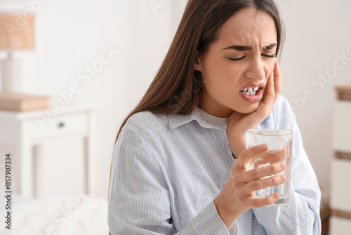 Young woman with cold water...