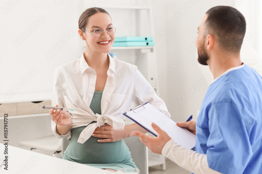Fototapeta premium Young pregnant woman with gestational diabetes and lancet pen visiting doctor in clinic