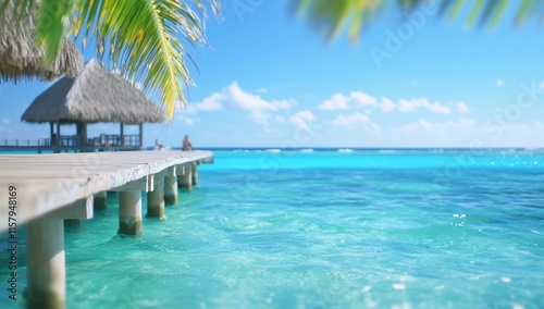 A serene tropical scene featuring a wooden pier over clear blue water.