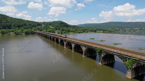 PENNSYLVANIA - 7.11.2024 - Fantastic aerial view of an Amtrak train traveling on the Rockville Bridge over the Susquehanna River.