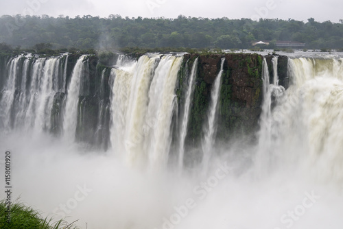 Breathtaking section of Iguazu Falls, showcasing the immense power of water as it plunges into a foggy cloud photo