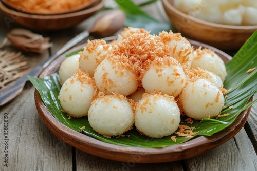 Biji Salak is a popular Indonesian dessert particularly during Ramadan It consists of sweet potato balls in palm sugar syrup typically enjoyed with coconut milk photo