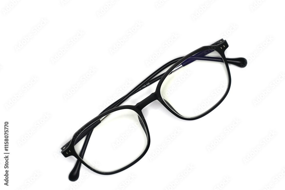 A pair of black eyeglasses is isolated against a white background. A pair of black eyeglasses is isolated against a white background.