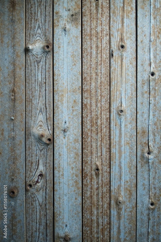 Naklejka premium Distressed wooden plank background with subtle texture and grays, texture, wood surface, rustic