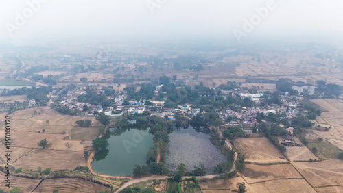 defaultAerial View of Village and Water Bodies, Countryside Scene with Lakes and Fields, Rural Village Landscape with Ponds, Top View of Rural Area with Lakes, Village Life Surrounded by Farmlands.  photo