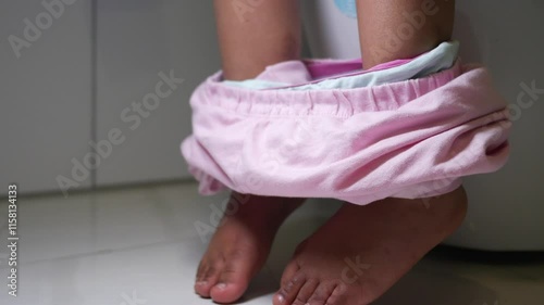 Child potty training in a toilet 