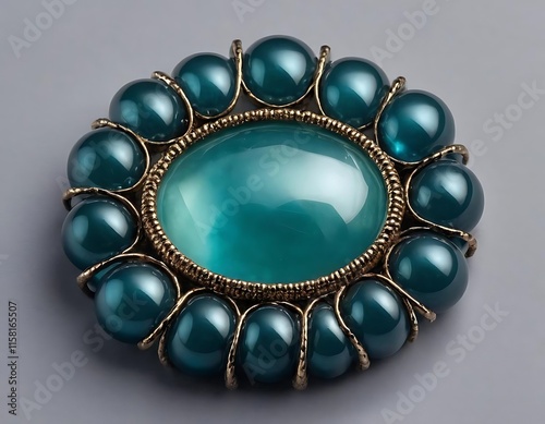 Teal Gemstone Brooch with Gold Setting and Round Design photo