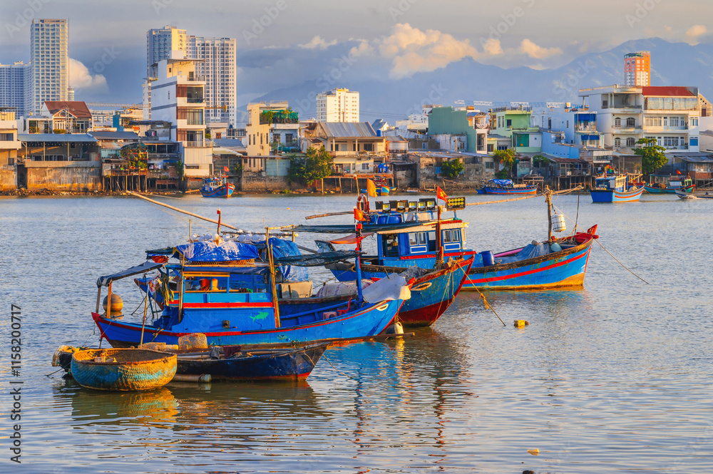 Mooring of traditional Vietnamese fishing boats in the Vietnam river in Nha Trang in Asia. Mooring of traditional Vietnamese fishing boats in the Vietnam river in Nha Trang in Asia.