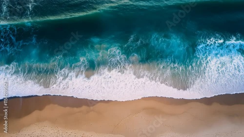 Aerial View of Ocean Waves Crashing on Sandy Beach