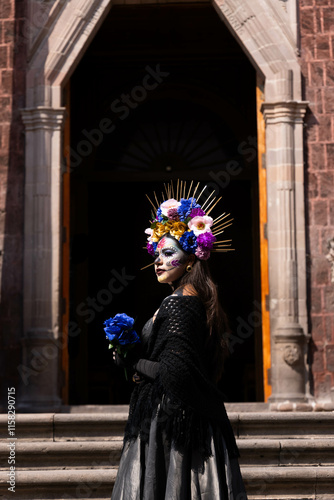 emblematic catrina of mexico with flowers and necklace in church with sempasuchil flowers in nature photo