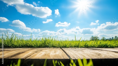 Fototapeta Naklejka Na Ścianę i Meble -  Natural spring garden background featuring vibrant fresh green grass, a bright blue sunny sky, and a rustic wooden table, perfect for displaying products in outdoor scenes.