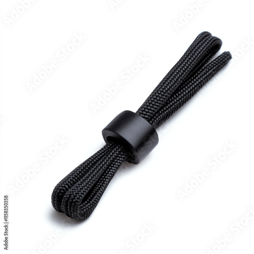 A neatly arranged black shoelace with a holder on a white isolated background.