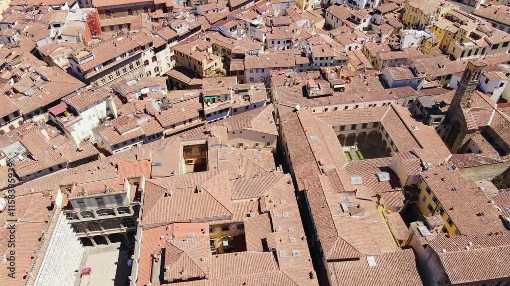 Drone of Florence rooftops - terracotta textures glowing under the summer heat Drone of Florence rooftops - terracotta textures glowing under the summer heat