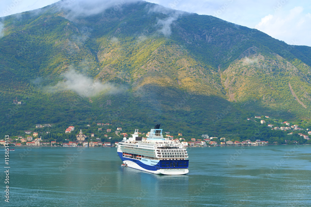 Cruise ship on Montenegro scenic coastline Cruise ship on Montenegro scenic coastline