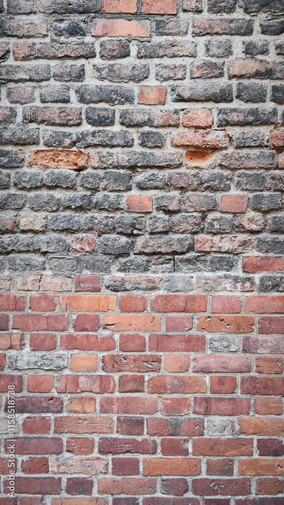 Fototapeta premium Old Brick Wall - Vertical Texture of Red and Gray Bricks, Rustic and Industrial Look, Perfect for Architectural or Decorative Backgrounds