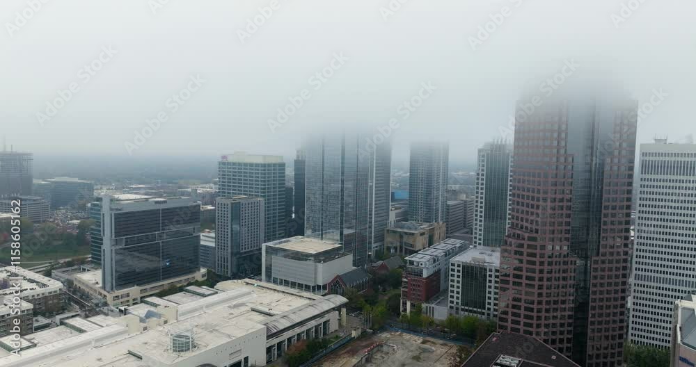 Uptown Charlotte Skyline Covered With Fog In North Carolina, United States. - aerial shot Uptown Charlotte Skyline Covered With Fog In North Carolina, United States. - aerial shot