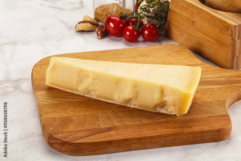 Hard parmesan cheese piece triangle Hard parmesan cheese piece triangle