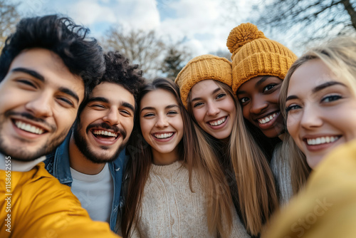 Group of multiracial young student people smiling and taking selfie together.