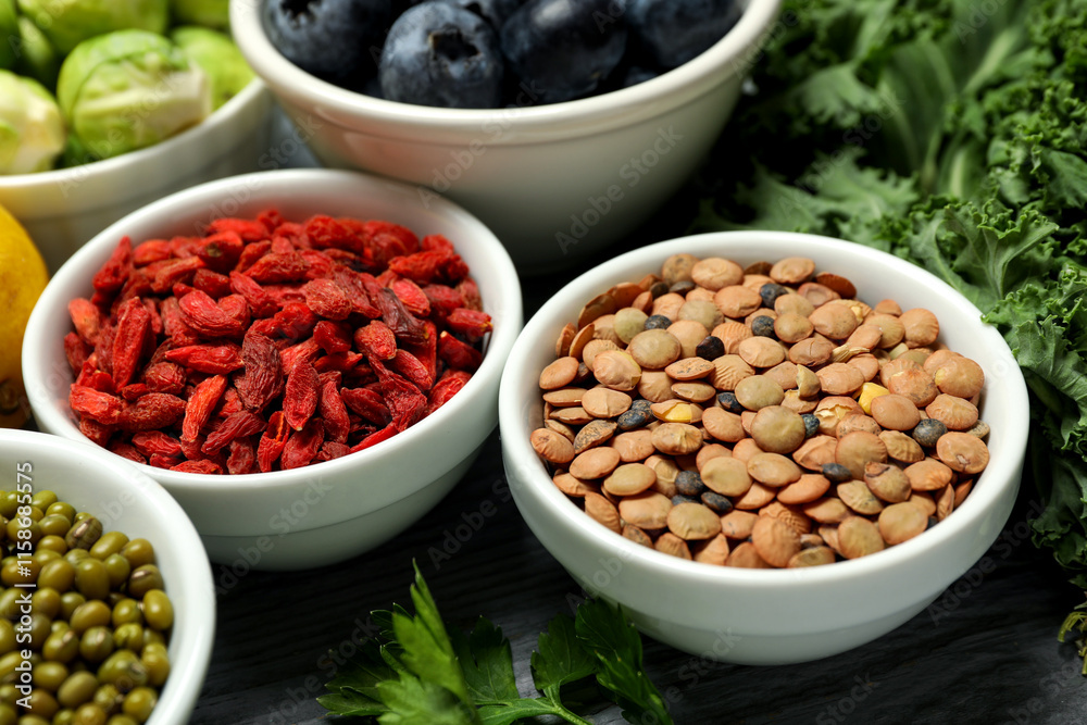 Superfood. Different healthy food products on table, closeup Superfood. Different healthy food products on table, closeup