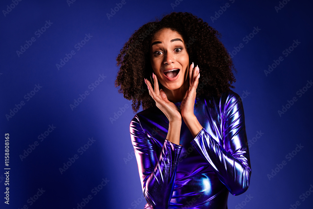 Glamorous young woman in purple dress celebrating at a club Glamorous young woman in purple dress celebrating at a club