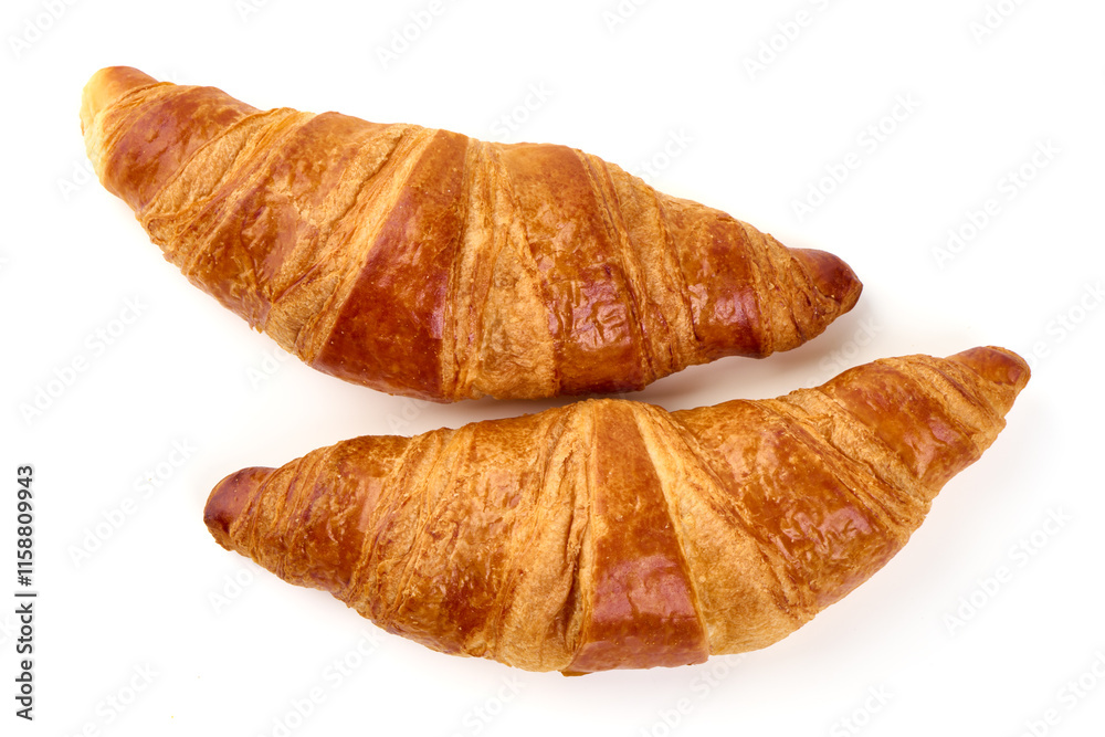 Two buttery croissants isolated on white background. Two buttery croissants isolated on white background.