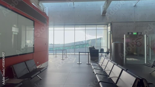 Waiting lounges at Larnaca Airport featuring seating areas, entertainment zones, and relaxation spots. Transit waiting for travelers photo