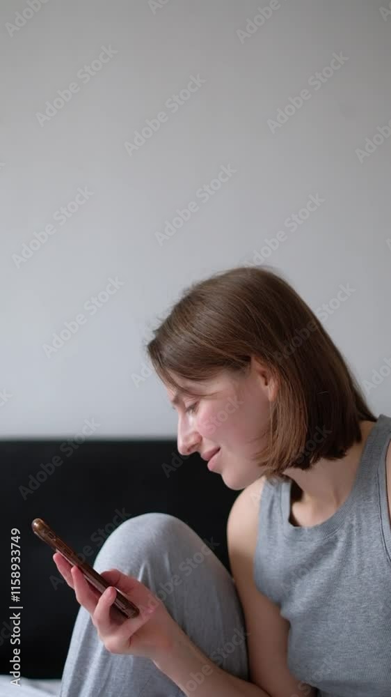 Woman Engaged in Online Conversation on Phone Woman Engaged in Online Conversation on Phone
