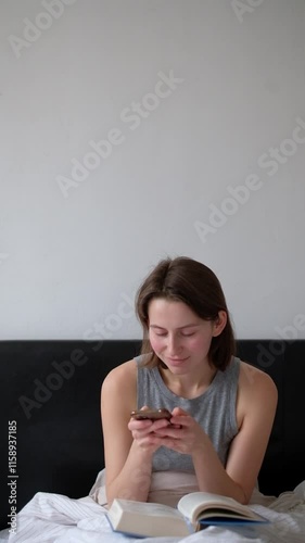 Woman Sitting on Bed Texting Online