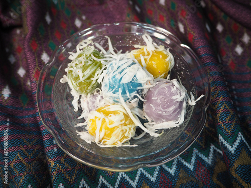 Thai Coconut Rice Ball Dessert on Vibrant Fabric 
Fluffy cupcakes 2