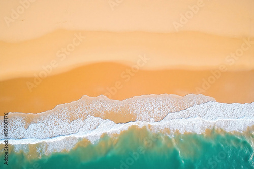 Sandy beach at high tide with turquoise waves