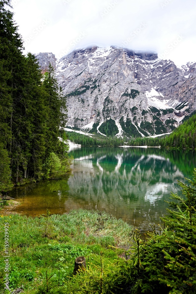 Fototapeta premium Beautiful landscape panorama of the Pragser Wildsee, Lake Prags, Lake Braies, Lago di Braies, Pragser Wildsee in the Dolomites in South Tyrol, Italy. Hiking and holidays in South Tyrol.