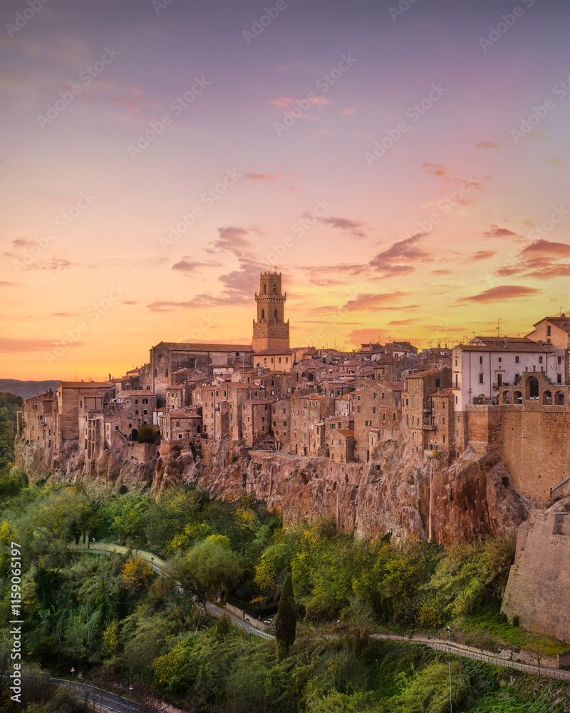 Naklejka premium Tuscany, Pitigliano medieval village panorama sunset. Italy