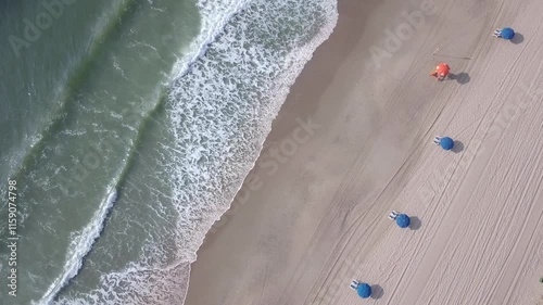 Aerial straight down view of waves crashing along the Atlantic coast at Myrtle Beach, South Carolina, USA.