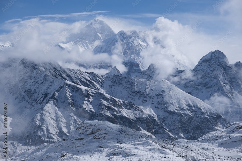 Obraz premium Amazing winter scenery of Himalaya panorama with Mount Everest among clouds from route to Renjo La Pass. Sagarmatha National Park, Himalayas, Nepal