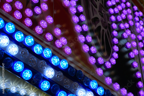 Amusement park . Ferries at night. Disco lights. Colorful Illumination. Light bulbs.