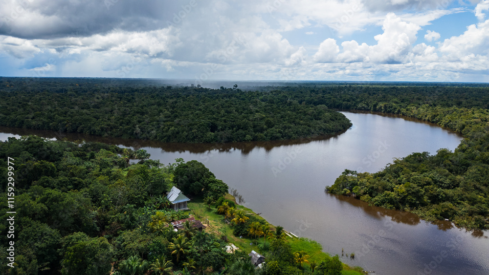 Fototapeta premium AERIAL PHOTOS OF THE NANAY RIVER AND BOATS NAVIGATING IN ITS WATERS, IN THE PERUVIAN AMAZON JUNGLE, BLACK WATER IGAPO WITH COMMUNITIES OF PEOPLE SURROUNDING THE NANAY.