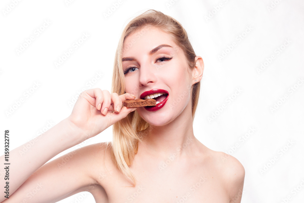Lovely smiling teenage girl eating chocolate Lovely smiling teenage girl eating chocolate