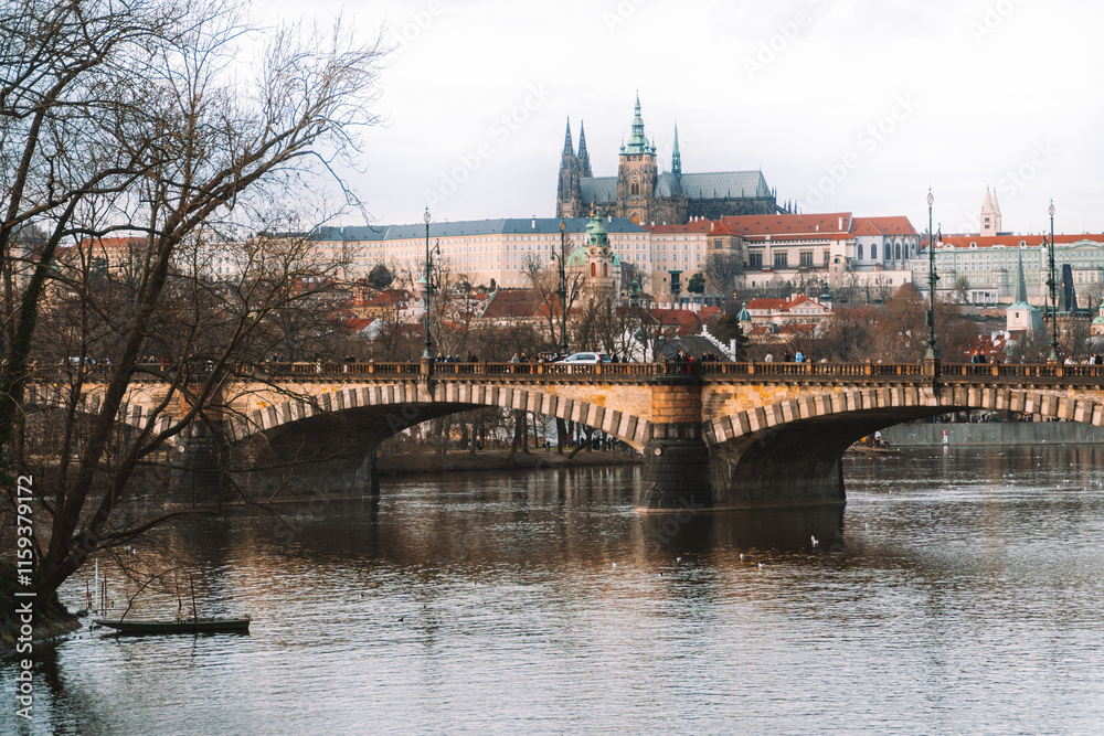 Obraz premium River at the colourfol and majestetic City of Prague on a moody day in Spring / Winter