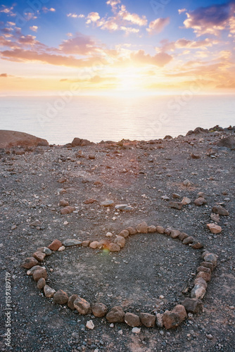 Heart of stones on the hills of Fuertawentura Island, Tarajalejo, sunset photo