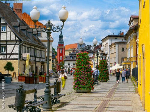 2024-05-27; Charming street in a historic European town showcasing beautiful architecture and vibrant colors on a sunny day, Jelenia Gora, Poland. photo