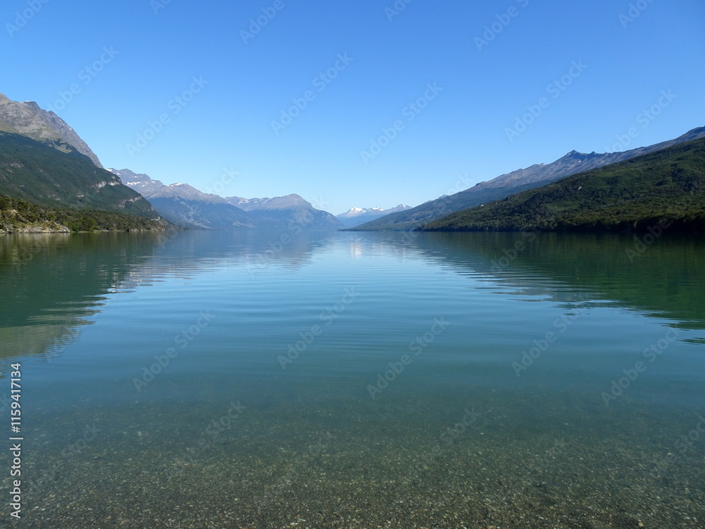 Fototapeta premium the national park in Ushuaia, austral land in Tierra del fuego, Patagonia argentina. Idyllic nature background with tranquil water surface and mountains and blue sky in summer with copy space. 