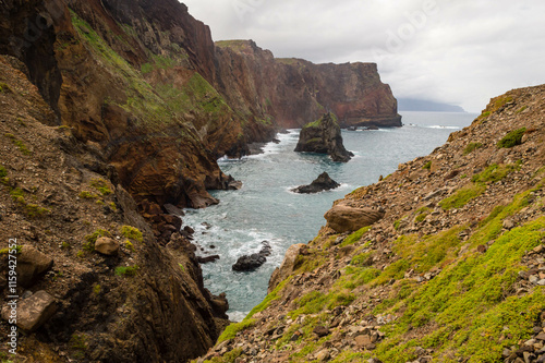 The majestic cliffs surrounded by blue waters. Vereda da Ponta de Sao Lourenco, Madeira, Portugal