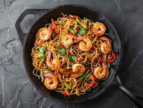 A delicious and healthy dish featuring lo mein noodles, shrimp, and vegetables such as bell peppers.