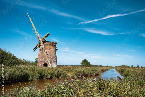 Uk, Norfolk - Sept 24: Brograve mill slowly falling apart under a sunny sky photo