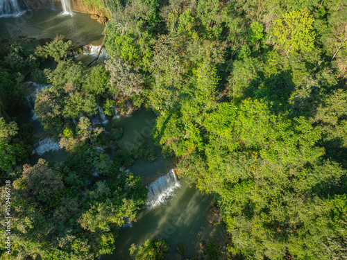 Aerial View Numerous waterfalls flow from wide, steep cliffs. .Thi Lor Su waterfall Nestled amidst the untouched beauty of Tak Province..Thi Lo Su Waterfall The Largest Waterfall in Thailand. photo