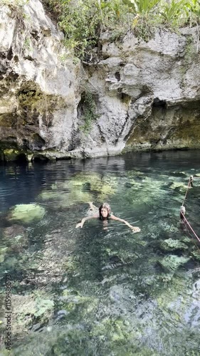 Swimming in Heart Cenote, Yucatán, Mexico , Underwater Adventure and Bathing. Exploring Heart Cenote in Yucatán, Mexico ,  Swim, Dive, and Relax in Crystal Waters