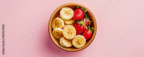 Obraz na płótnie Healthy lifestyle concept, wooden bowl with sliced fruit, fresh strawberries and bananas. w salonie
