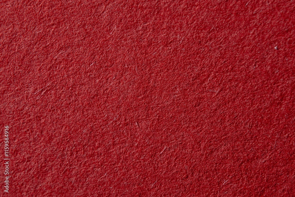 Fototapeta premium Red fluffy velvet texture background. Red velvet fabric