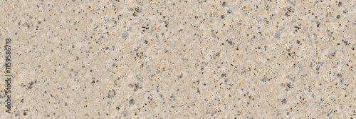 Textured terrazzo surface with blue and beige speckles
