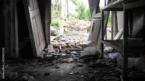 View to destroyed residential buildings at Kharkivska oblast. Ruined houses after bomb attacks on ukrainian territory from russia army. Consequences of russian invasion of Ukraine. Slow motion photo